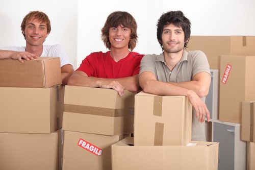 Professional team handling furniture pick-up in Merton storage