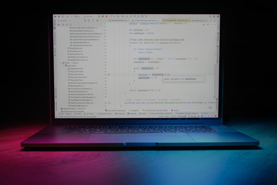 Close-up image of a computer screen displaying lines of programming code with syntax highlighted in green, orange, blue, and purple against a black background, suggesting a technical or development en